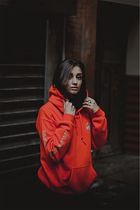 woman standing on brown post thumbnail