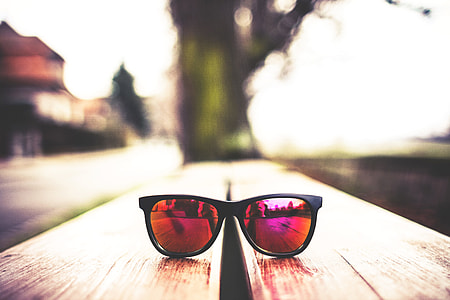 Red Fashion Glasses on Wooden Table thumbnail