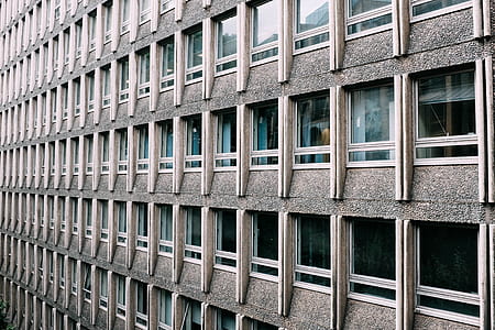 gray concrete building with glass window thumbnail