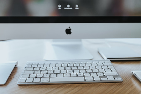 White Apple iMac computer with elephant mousepad thumbnail