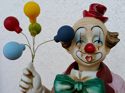 clown holding balloons figurine thumbnail