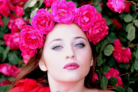 close-up photo of woman wearing red flower headband thumbnail
