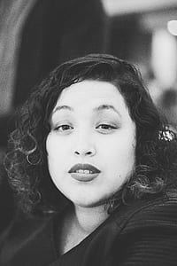 grayscale photo of woman thumbnail