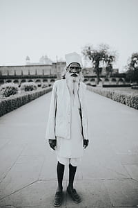 man standing in the middle of pathway thumbnail