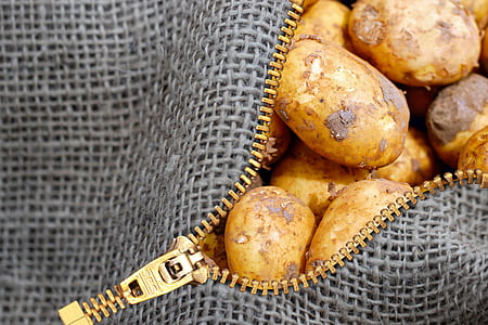brown potatoes in black zip bag thumbnail