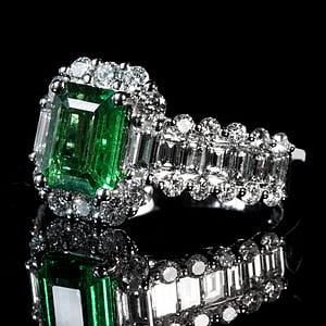 silver-colored ring with green gemstone thumbnail