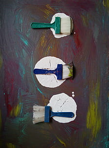 three assorted-color paint brushes thumbnail