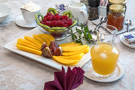 assorted fruits on plate and glass bowl thumbnail
