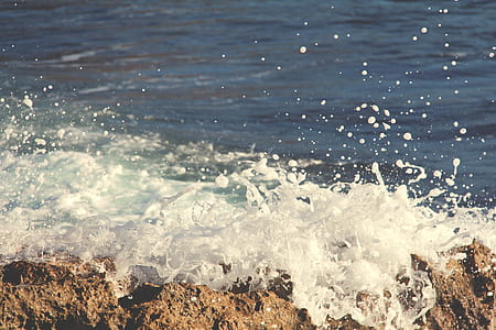 waves of body of water during daytime thumbnail