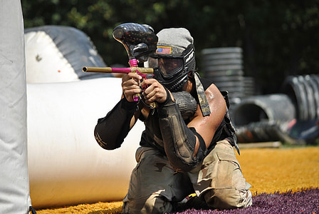 person holding pink paintball marker thumbnail
