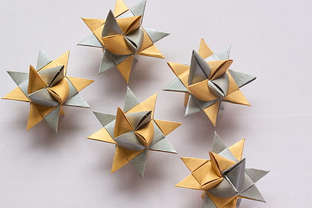 several orange-and-gray origami on gray surface thumbnail
