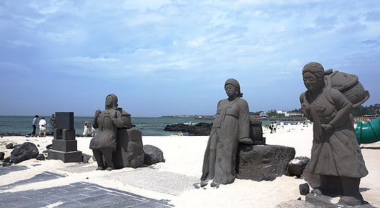 landscape photography of statue near seashore thumbnail