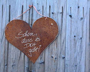 brown wooden heart hanging signage on wall thumbnail