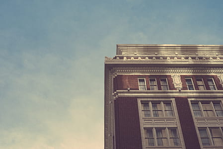 low angle photography of brown building thumbnail