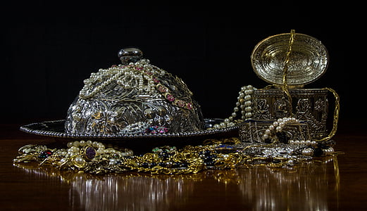 shallow focus photography of assorted jewelries on brown wooden table thumbnail