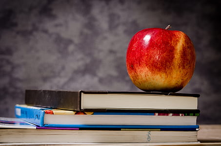 red apple on black book thumbnail