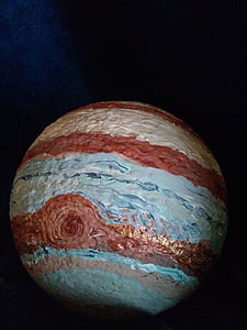 round multicolored ball inside dark room thumbnail