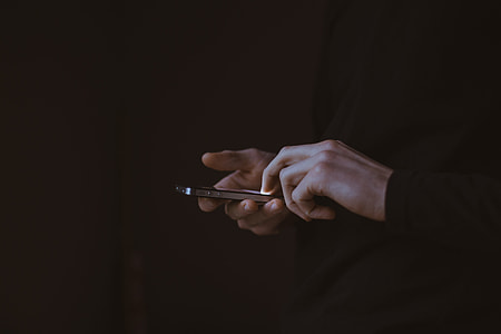 person using iPhone thumbnail