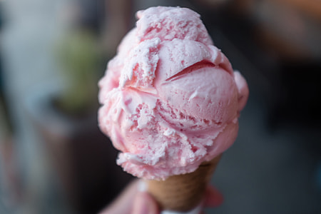 Closeup shot of pink ice cream cone thumbnail
