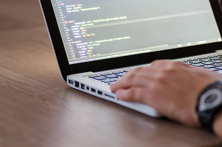 person holding laptop computer thumbnail