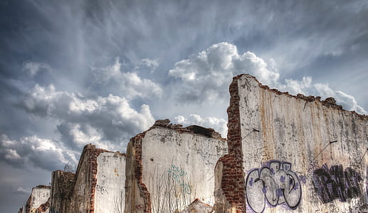 gray and white concrete walls under white cloudy sky thumbnail