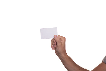 person's right hand holding white card thumbnail