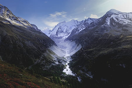 mountain alps under blue and white sky at daytime thumbnail