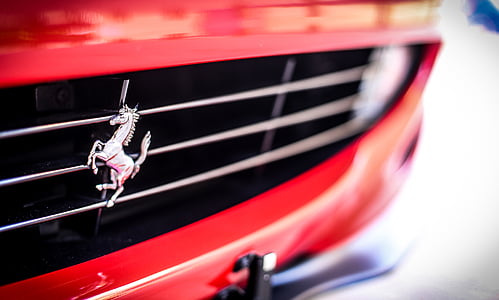 close-up photo of Red Ford Mustang grille thumbnail