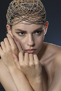 woman wearing brown and black beaded hair ornament thumbnail