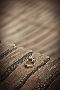 silver-colored couple ring on surface thumbnail