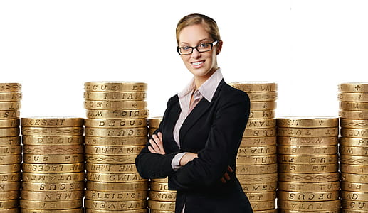 Photo illustration of woman financial planner in front of stack of coins. thumbnail
