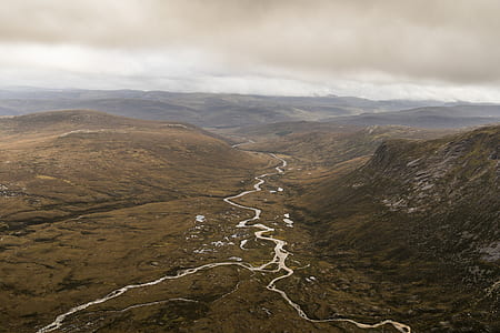 aerial photography of mountain range with river thumbnail