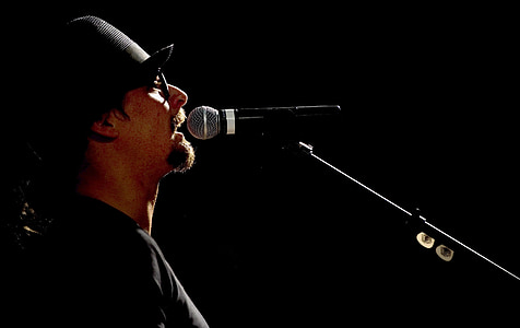 close-up photo of man singing thumbnail