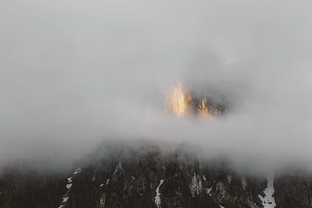 mountain covered with fog at daytime thumbnail
