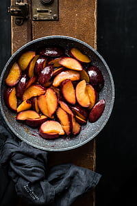 sliced fruits filled gray bowl thumbnail