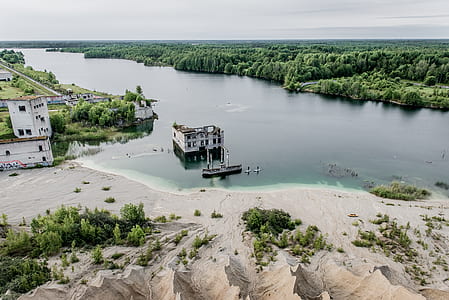 gray concrete building on body of water thumbnail