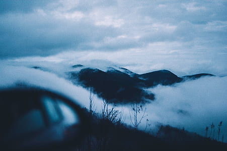 photography of mountain covered with fog thumbnail