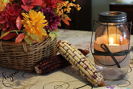 two corn cubs beside lamp on table thumbnail