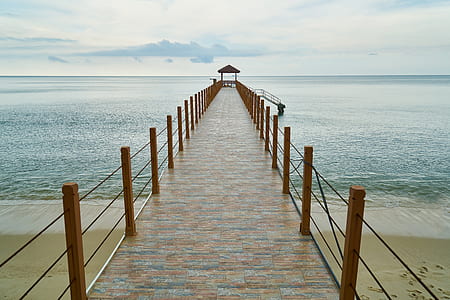 dock under white sky during daytime thumbnail