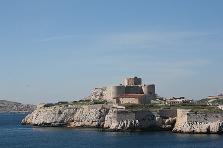 gray concrete building on island thumbnail