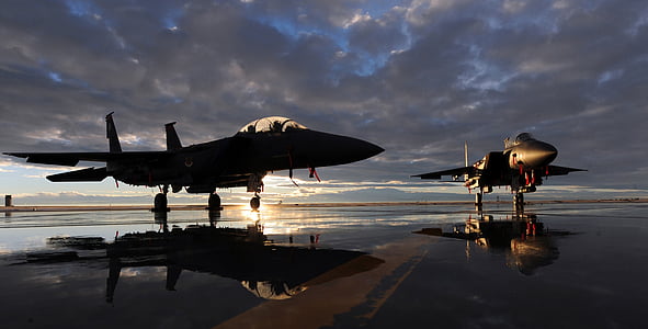 silhouette of two planes during cloudy sky thumbnail