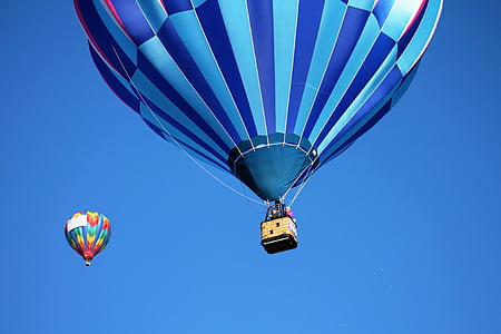 two blue, red, and white hot air balloons thumbnail