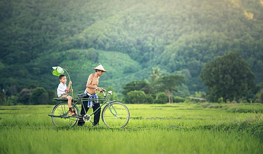 man holding gray bike thumbnail