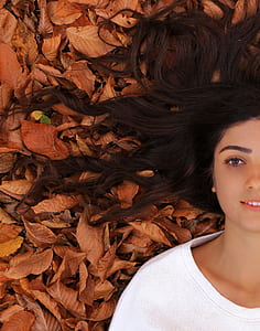 woman lying on dry leaves thumbnail