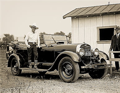 man standing beside convertible vehicle thumbnail