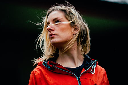 woman in red jacket being photographed thumbnail