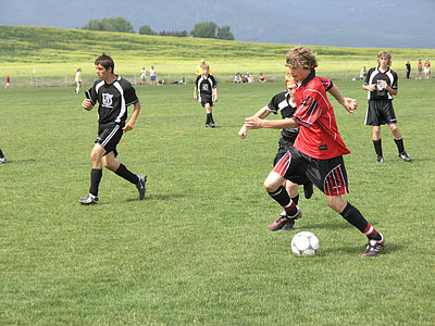male soccer players on ball field thumbnail