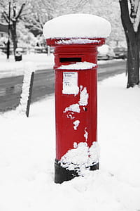 red metal post in snow covered ground thumbnail