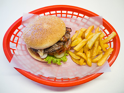 burger and fries on red plastic basket thumbnail
