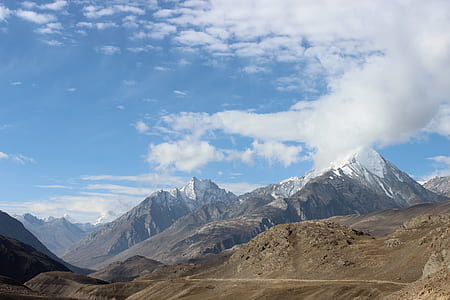 snow mountain under cloudy sky during daytime thumbnail